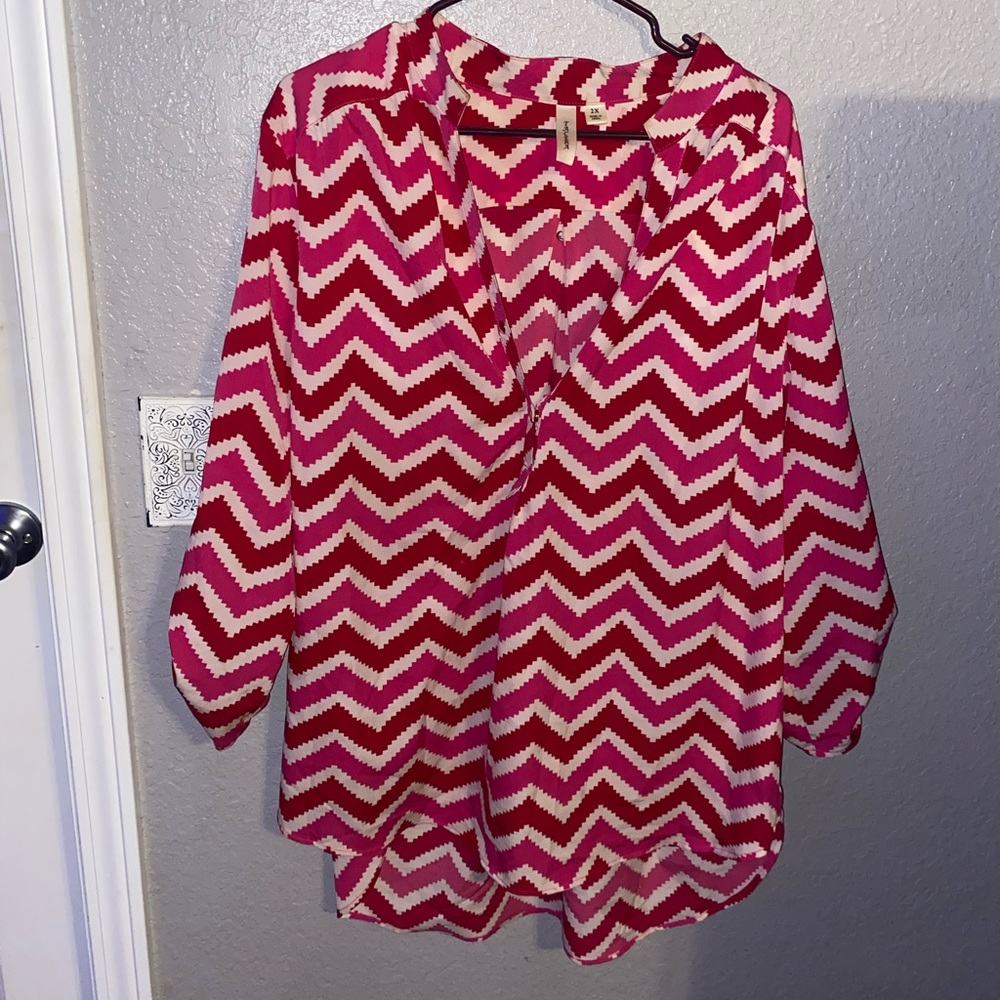 Red pink and white blouse.